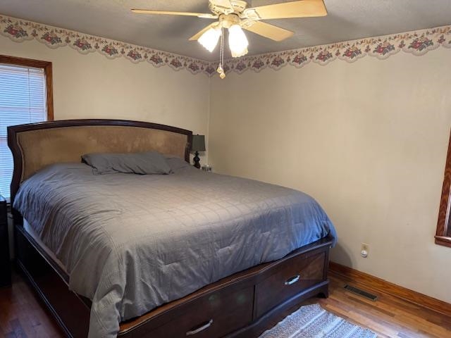 110 Levoid Road Bolivar, TN 38008 - Photo 10 of 22 a bedroom with a bed and a chandelier