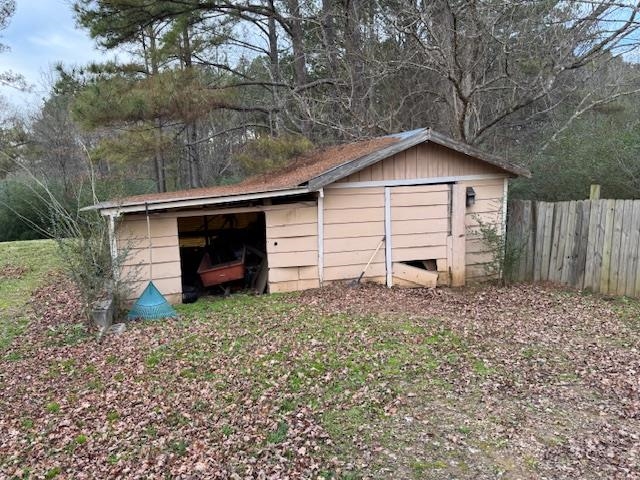 110 Levoid Road Bolivar, TN 38008 - Photo 16 of 22 a view of a house with a small yard and a large tree
