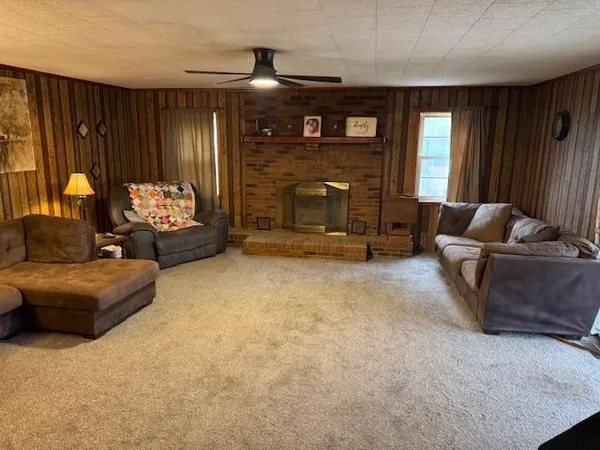 a living room with furniture and a fireplace