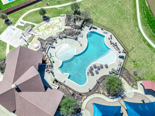 a view of swimming pool with a patio