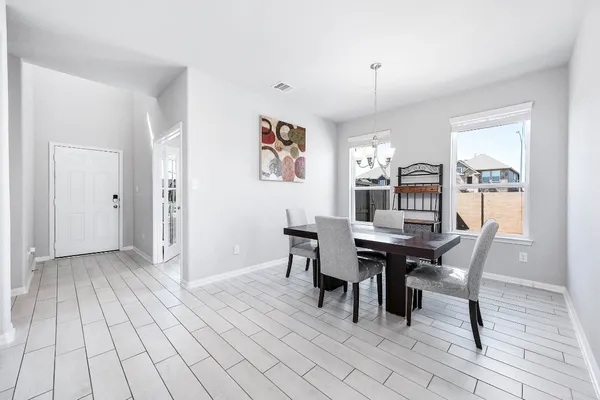 a view of a dining room with furniture and window