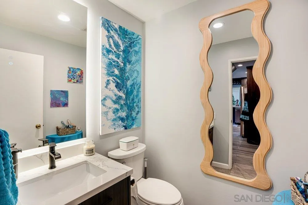 13358 Birch Tree Lane Poway, CA 92064 - Photo 7 of 16 a bathroom with a toilet sink and mirror