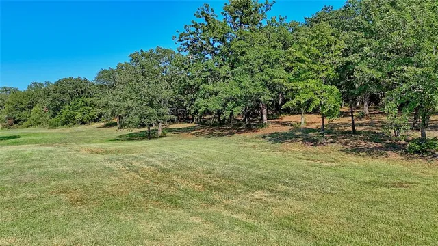 a view of outdoor space with deck and yard