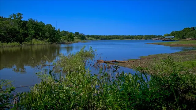 a view of a lake with a building in the background