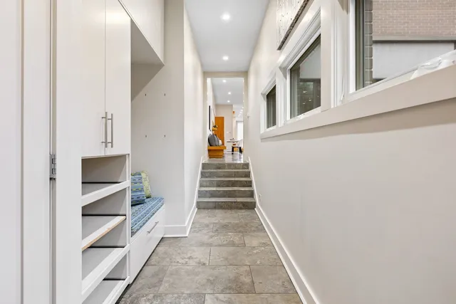 a view of a hallway with stairs