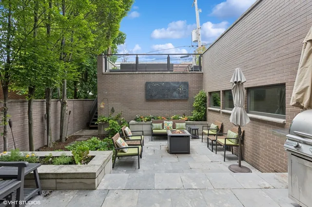 a view of a patio with a chairs and table in a patio