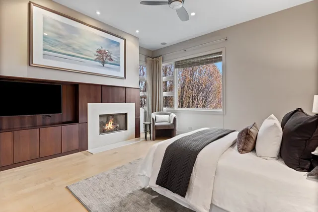 a bedroom with a bed and a fireplace