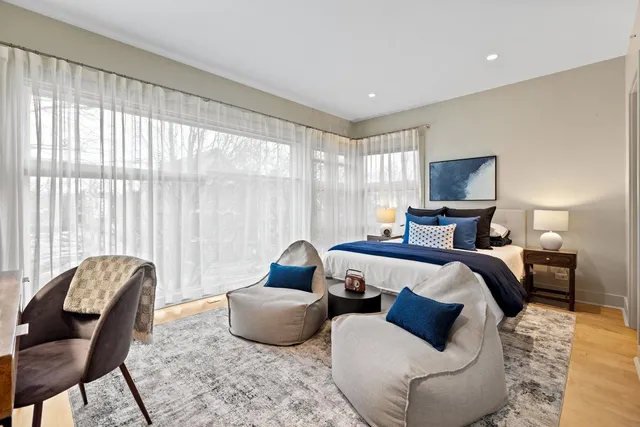 a bedroom with bed and window