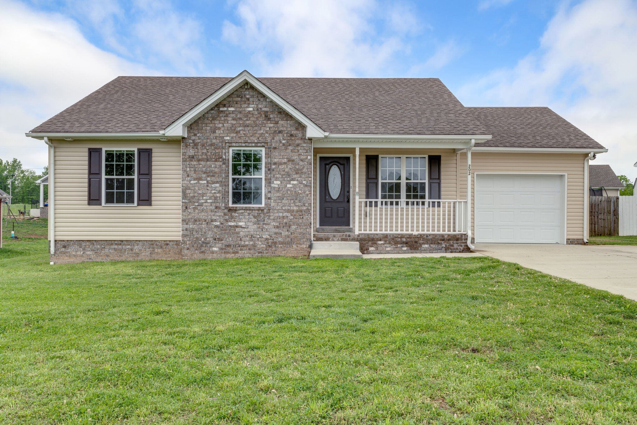 202 Shaub Road Portland, TN 37148 - Photo 1 of 25 a front view of a house with a yard