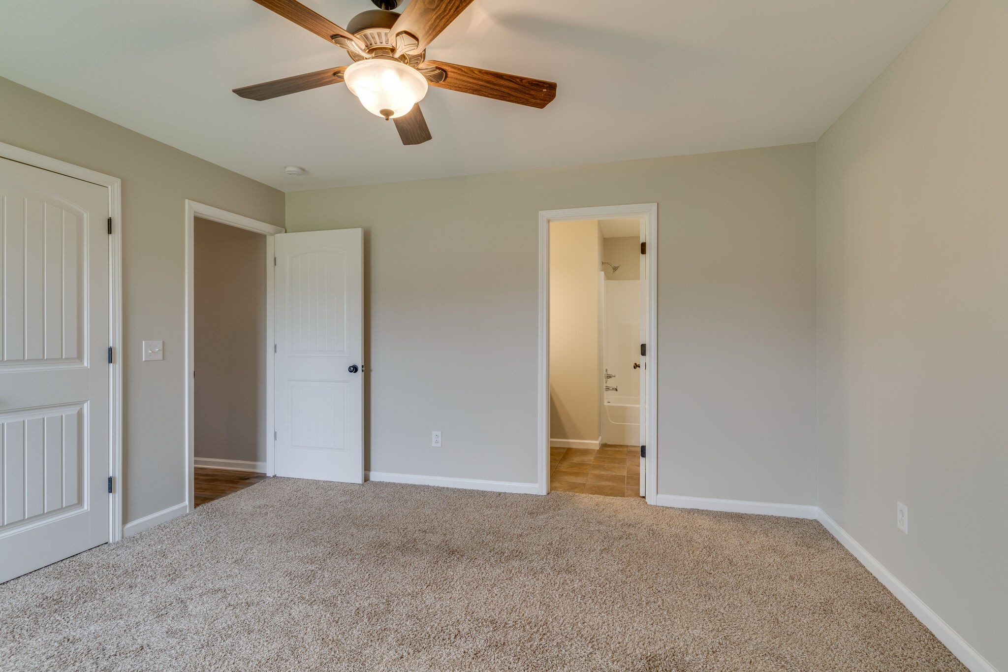 202 Shaub Road Portland, TN 37148 - Photo 11 of 25 an empty room with closet and a chandelier fan