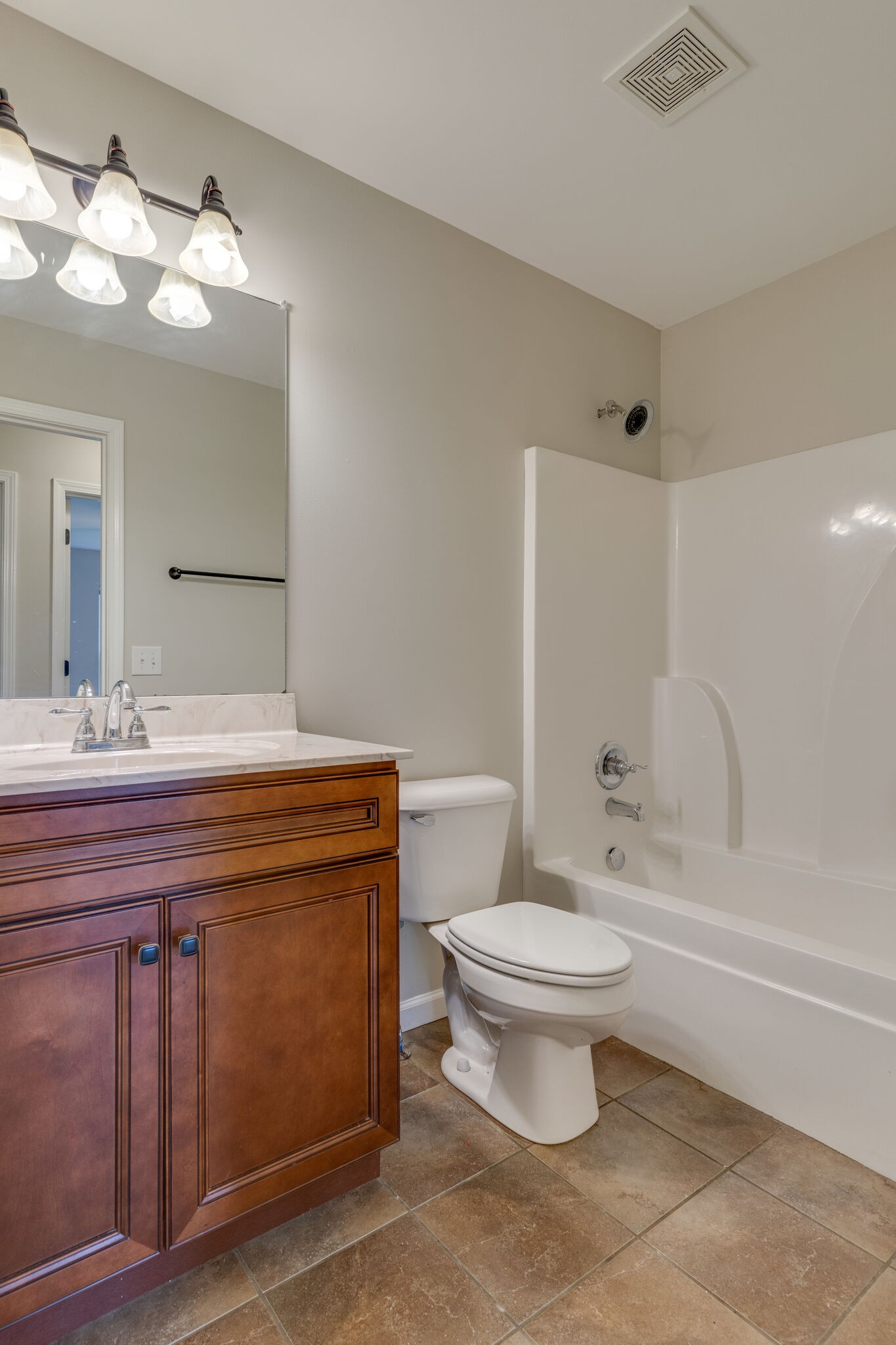 202 Shaub Road Portland, TN 37148 - Photo 17 of 25 a bathroom with a sink toilet and a mirror