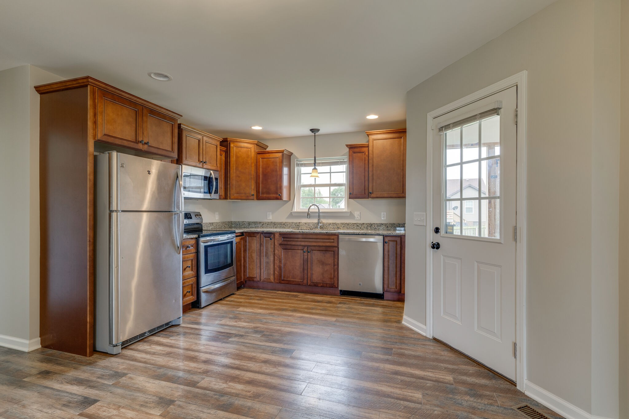 202 Shaub Road Portland, TN 37148 - Photo 6 of 25 a kitchen with stainless steel appliances granite countertop a refrigerator and a stove top oven