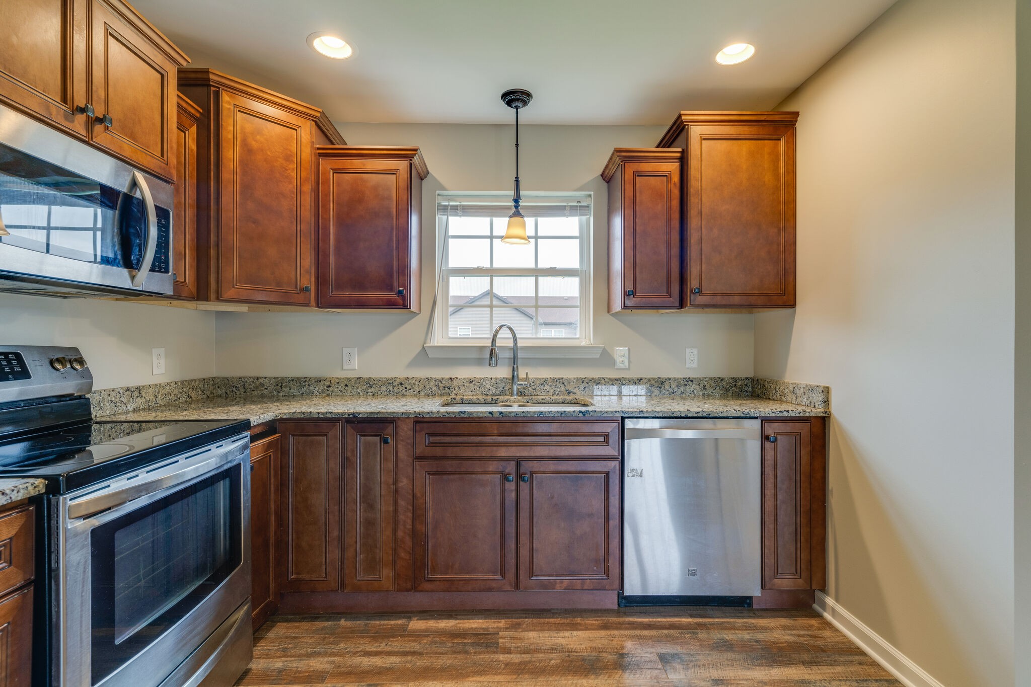 202 Shaub Road Portland, TN 37148 - Photo 8 of 25 a kitchen with stainless steel appliances granite countertop a sink stove and cabinets