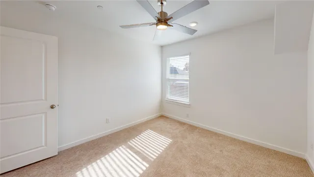 a view of room with a ceiling fan and hardwood floor