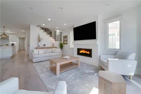 a kitchen with a table chairs sink and cabinets