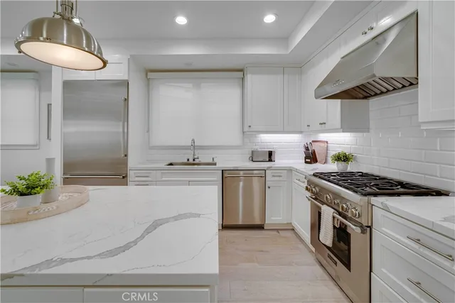 a bathroom with a sink toilet mirror and shower
