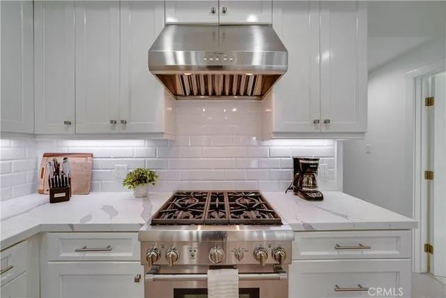 a spacious bedroom with a bed and a flat screen tv