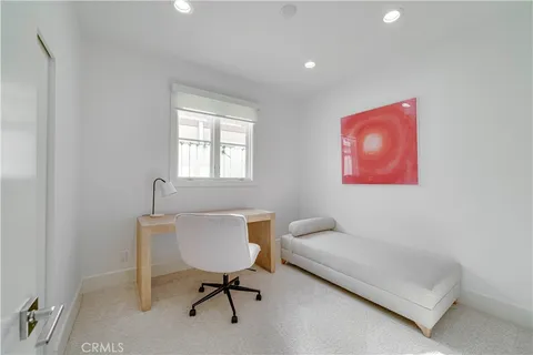 a spacious bedroom with a large bed and a fireplace