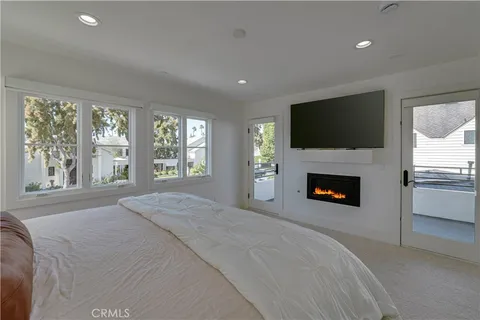 a view of backyard of a house with outdoor seating