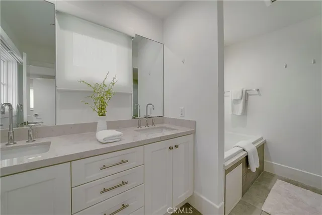 a large white bed in a white room