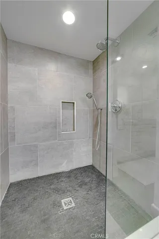 a bedroom with a large bed and a large window