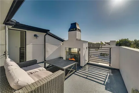 a view of a pathway of house with flower pots