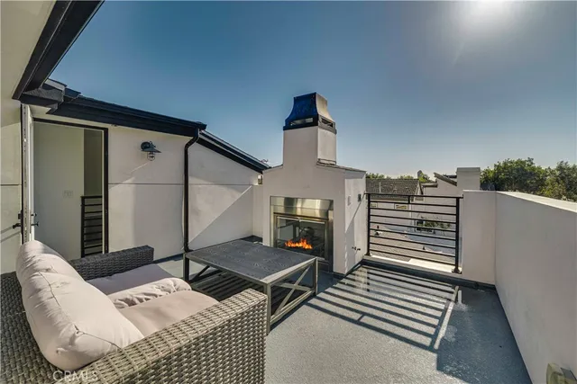 a view of a pathway of house with flower pots