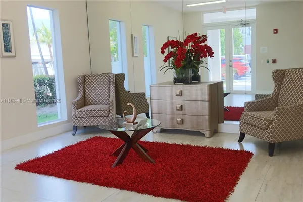 a living room with furniture and a potted plant