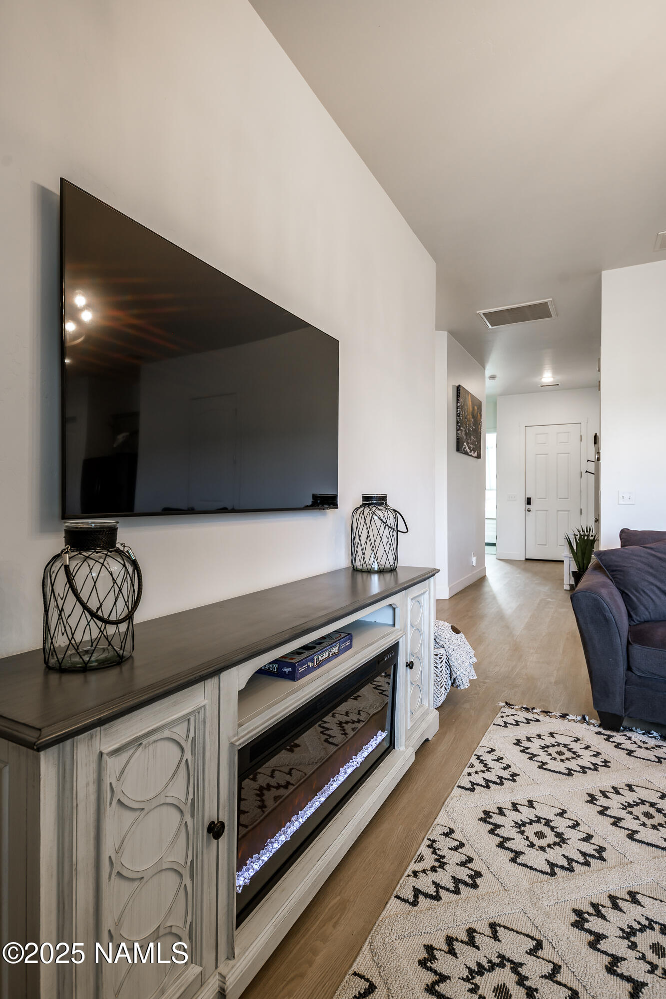 11780 Pegasus Road Bellemont, AZ 86015 - Photo 13 of 44 a bedroom with furniture and flat screen tv