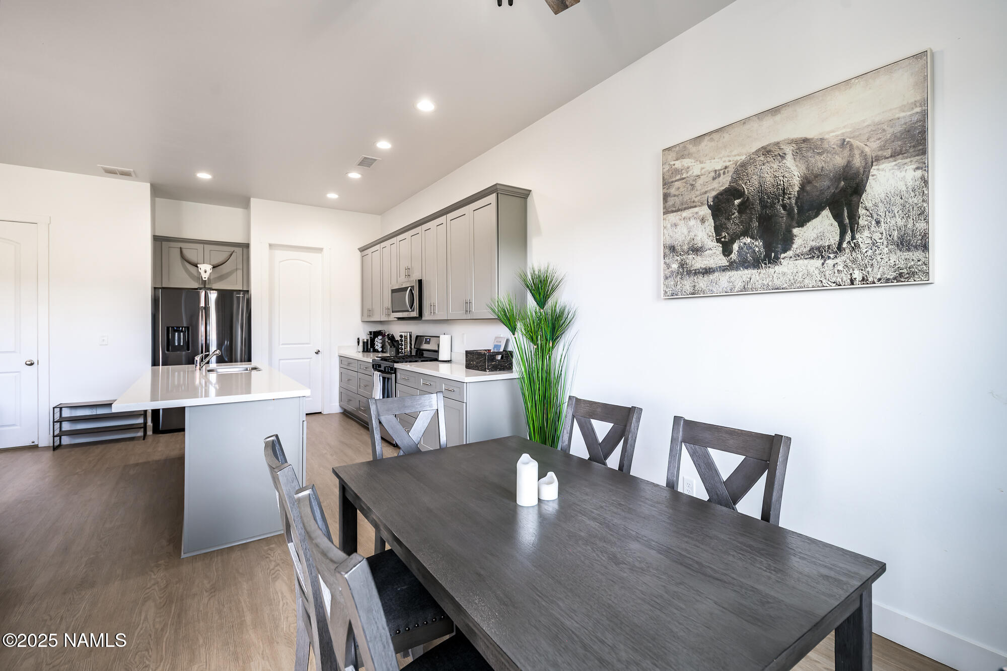 11780 Pegasus Road Bellemont, AZ 86015 - Photo 16 of 44 a view of a dining room with furniture and wooden floor