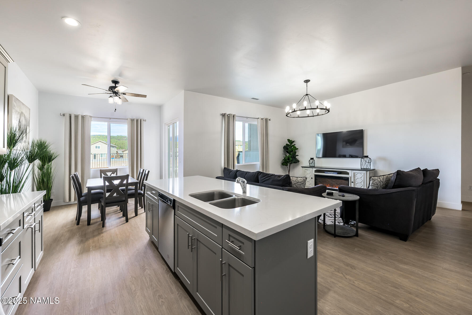 11780 Pegasus Road Bellemont, AZ 86015 - Photo 19 of 44 a view of a dining room with furniture window and wooden floor