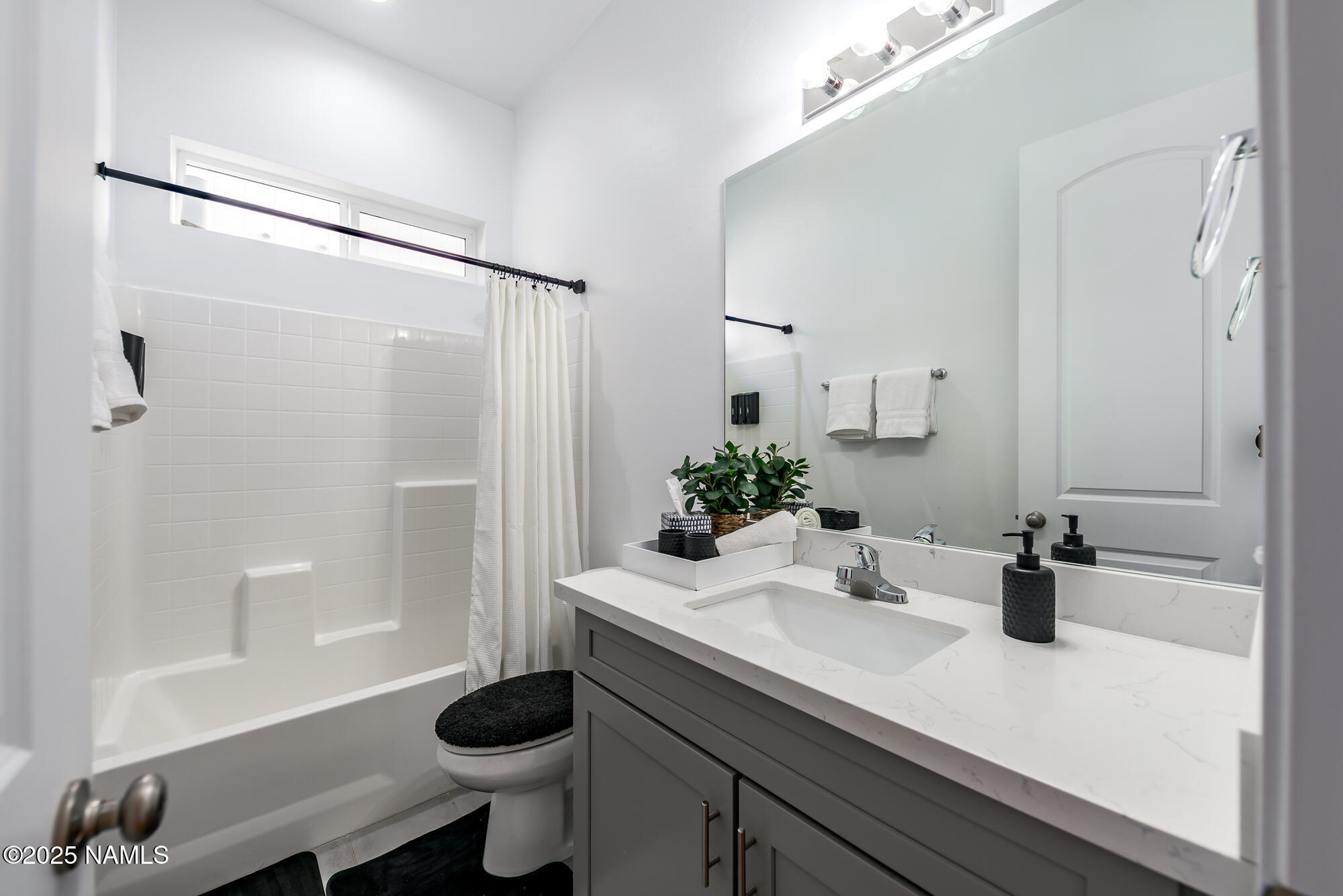 11780 Pegasus Road Bellemont, AZ 86015 - Photo 24 of 44 a bathroom with a sink a toilet and shower
