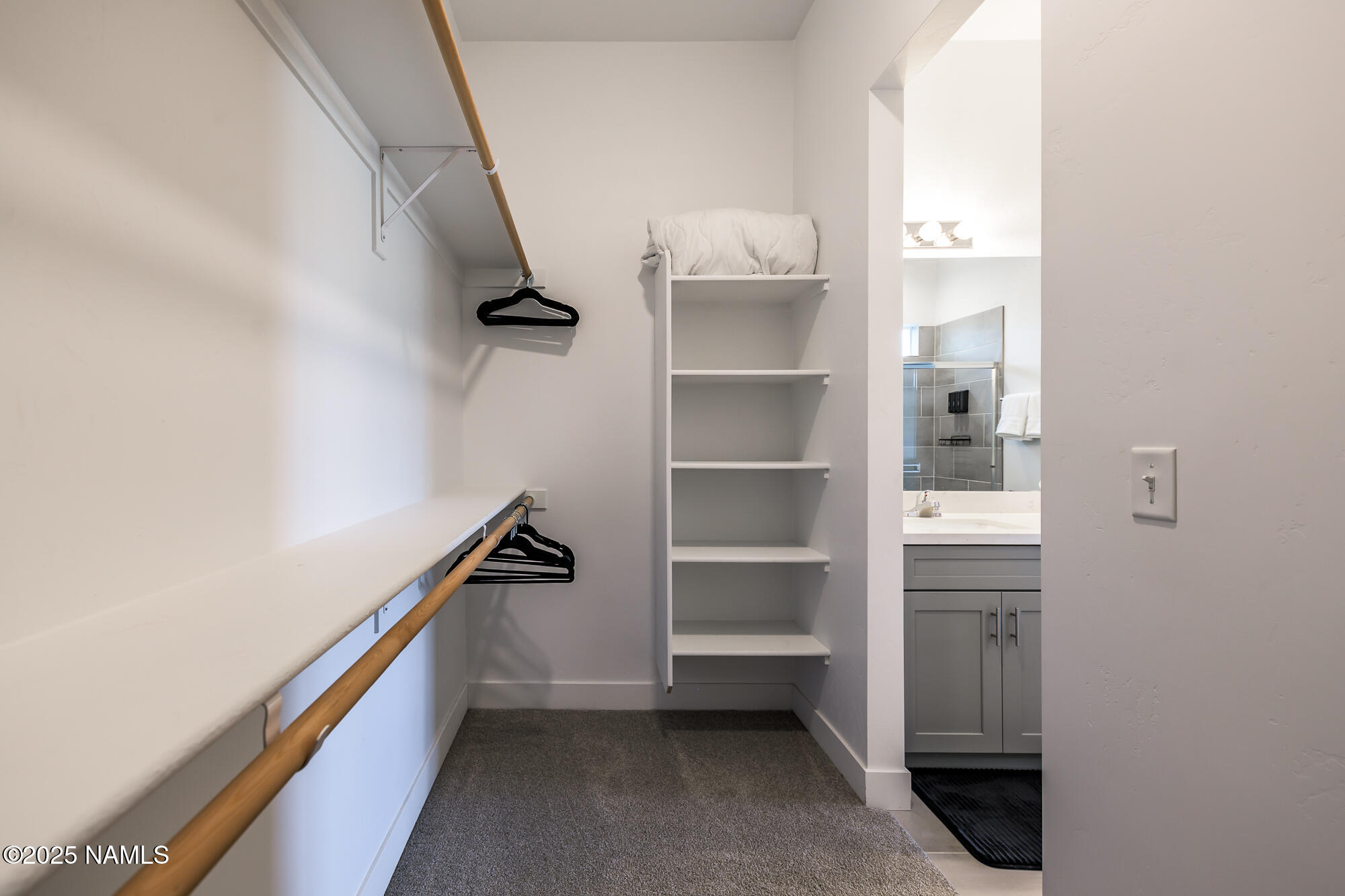 11780 Pegasus Road Bellemont, AZ 86015 - Photo 34 of 44 a view of hallway with walk in closet