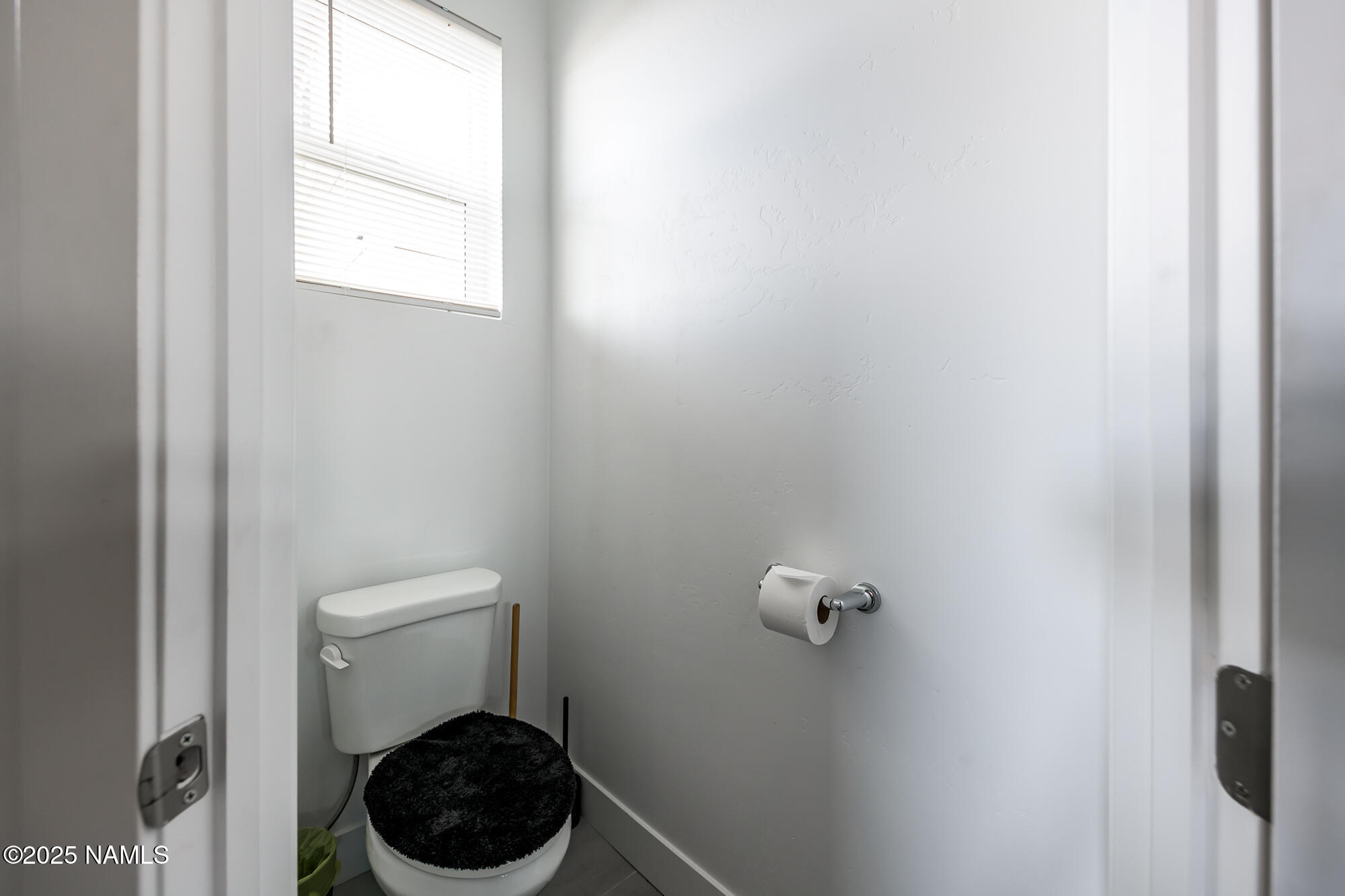 11780 Pegasus Road Bellemont, AZ 86015 - Photo 36 of 44 a bathroom with a toilet