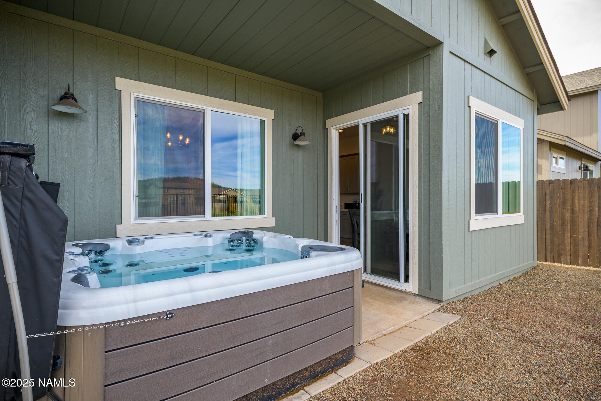 11780 Pegasus Road Bellemont, AZ 86015 - Photo 40 of 44 a bathroom with a granite countertop sink and a mirror