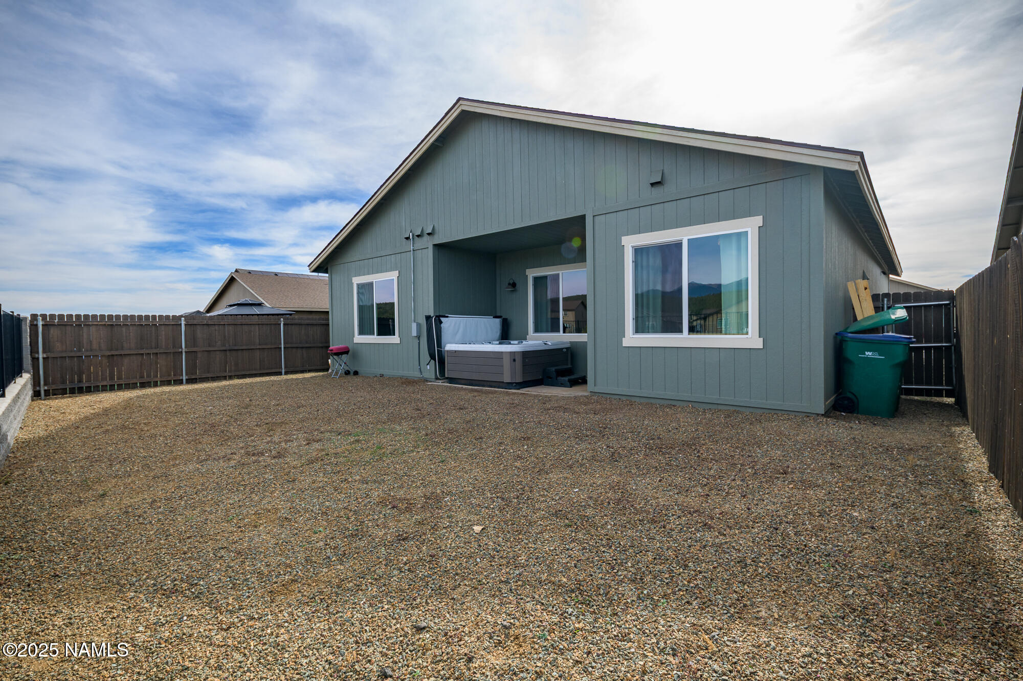 11780 Pegasus Road Bellemont, AZ 86015 - Photo 8 of 44 a view of house with backyard and glass windows