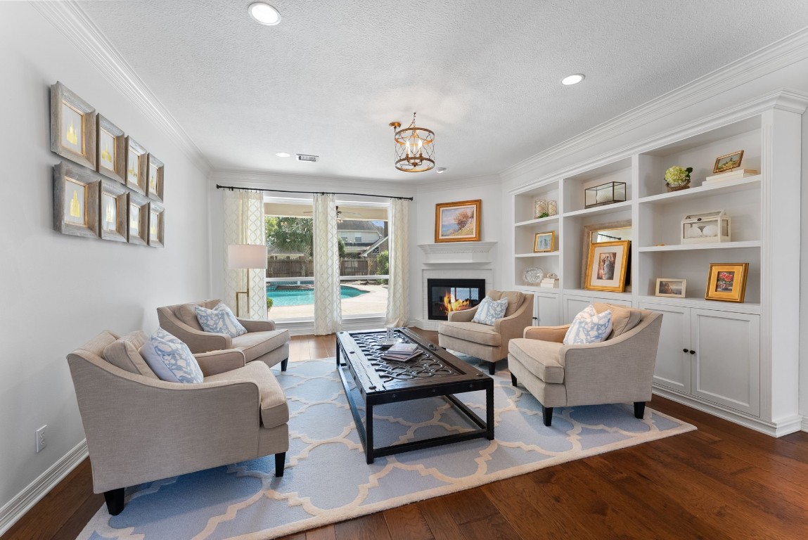 5503 Winding Ridge Drive Spring, TX 77379 - Photo 11 of 50 One of two living spaces on the first floor, both of which overlook the pool and massive backyard. Don't miss the double sided fireplace!