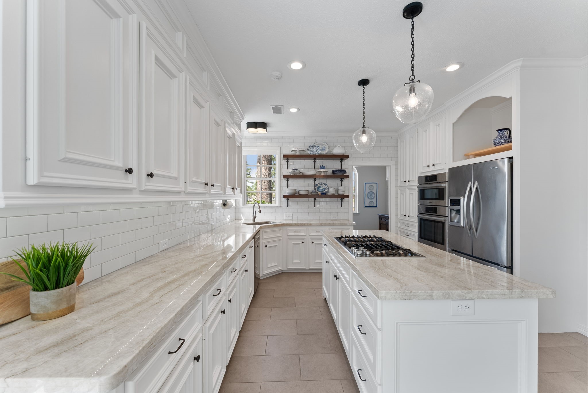 5503 Winding Ridge Drive Spring, TX 77379 - Photo 16 of 50 You will love the motion in these stunning Taj Mahal quartzite countertops and enjoy every moment of looking out of the sweet window over the sink.
