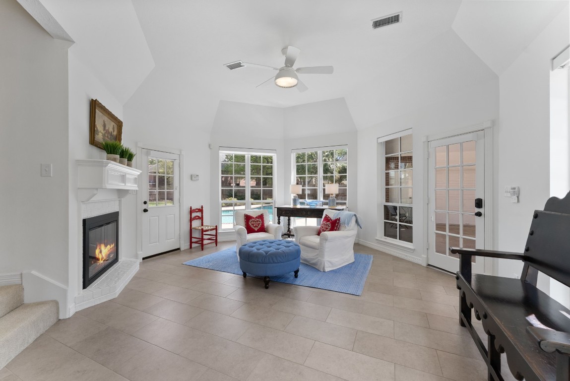 5503 Winding Ridge Drive Spring, TX 77379 - Photo 20 of 50 The den is located off of the kitchen and boasts a warming double sided fireplace and some of the best views in the house.