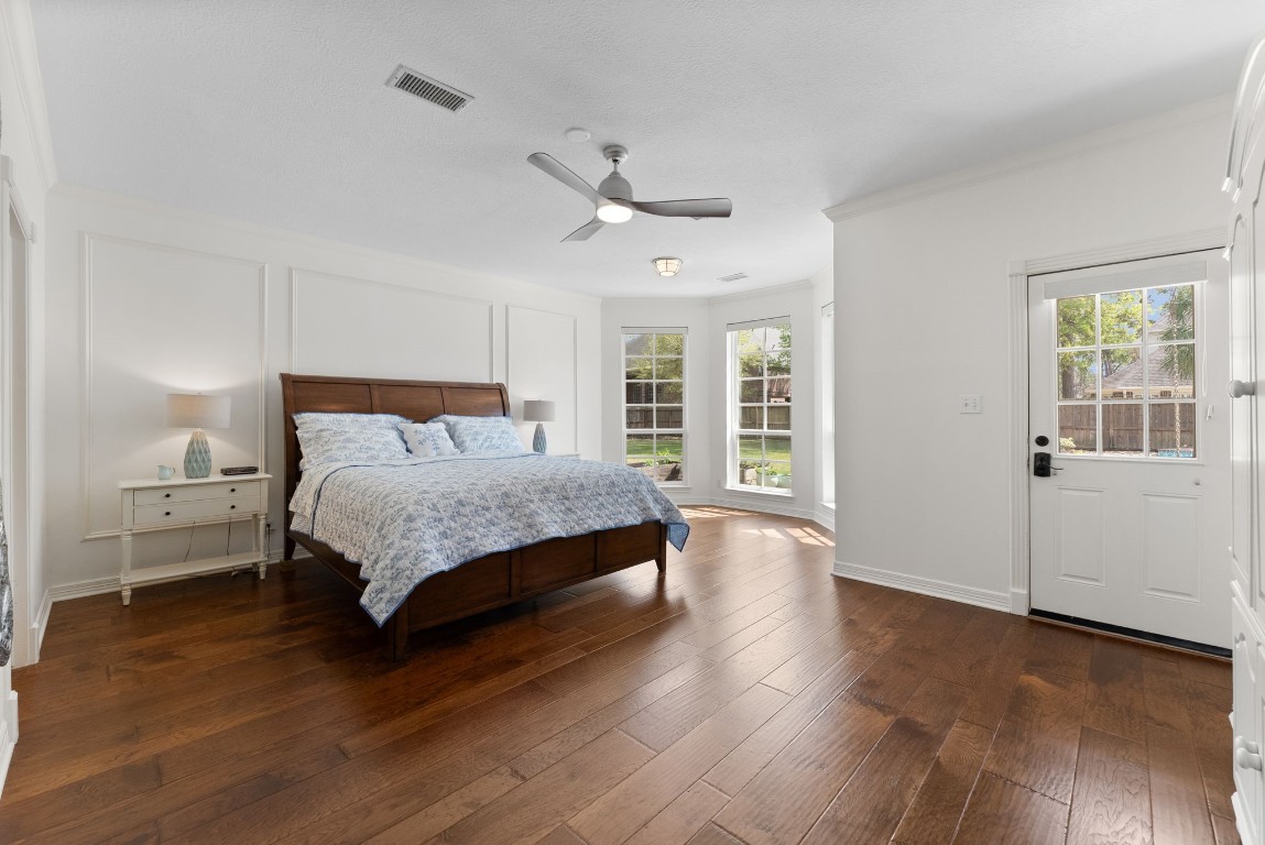 5503 Winding Ridge Drive Spring, TX 77379 - Photo 21 of 50 Primary suite privately tucked away on the first floor has bay windows, private backyard access and views of both the pool and enormous greenspace.