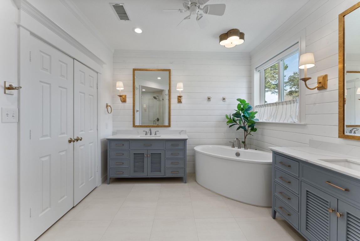 5503 Winding Ridge Drive Spring, TX 77379 - Photo 24 of 50 Fully remodeled primary bathroom with double vanities and double sinks, separate shower and deep soaking tub.
