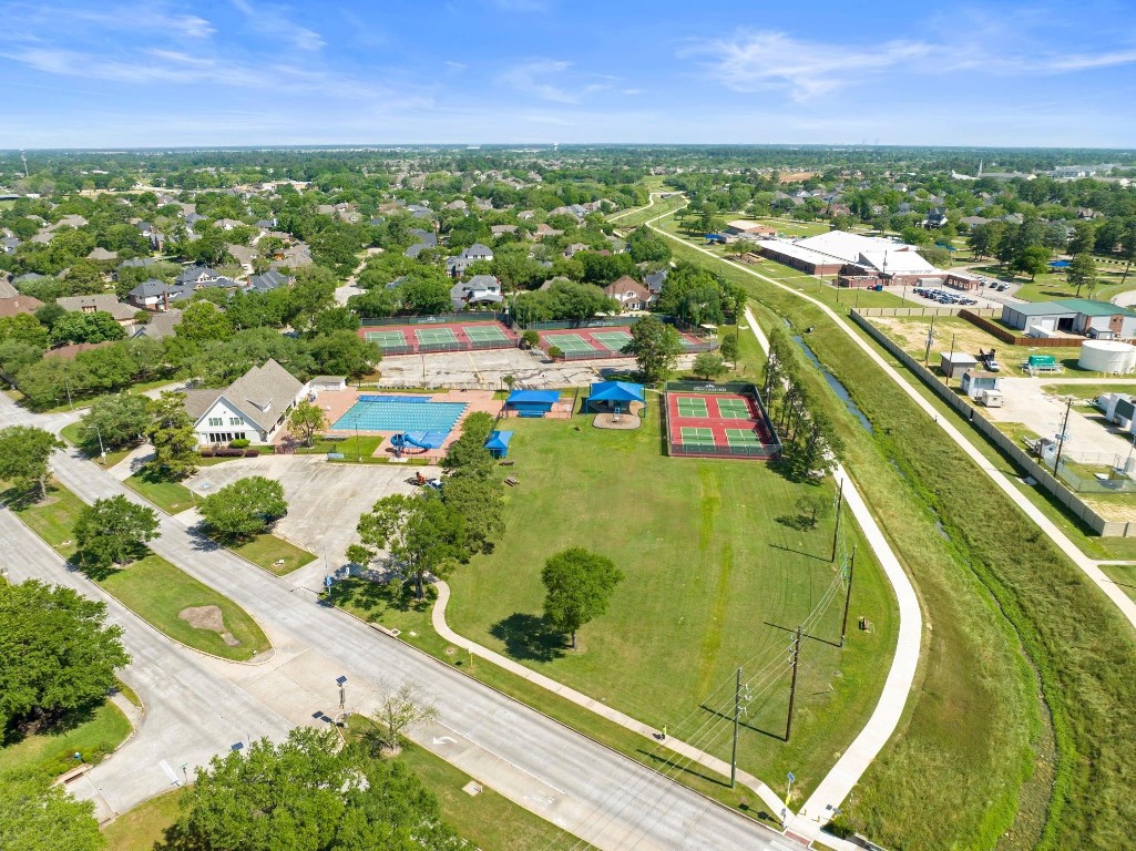 5503 Winding Ridge Drive Spring, TX 77379 - Photo 46 of 50 This neighborhood is full of walking paths, two community pools, multiple tennis courts, pickleball courts and this home sits close to the walking trail behind school, which leads down to the bridge where you can feed the turtles!