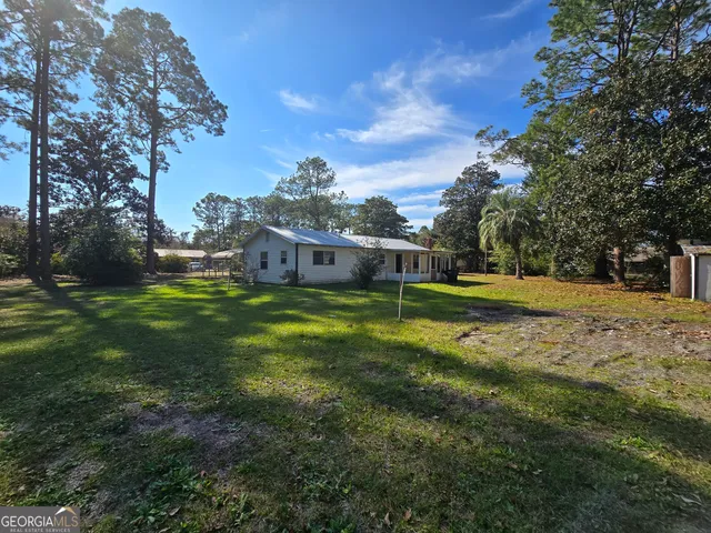 a view of a house with a big yard