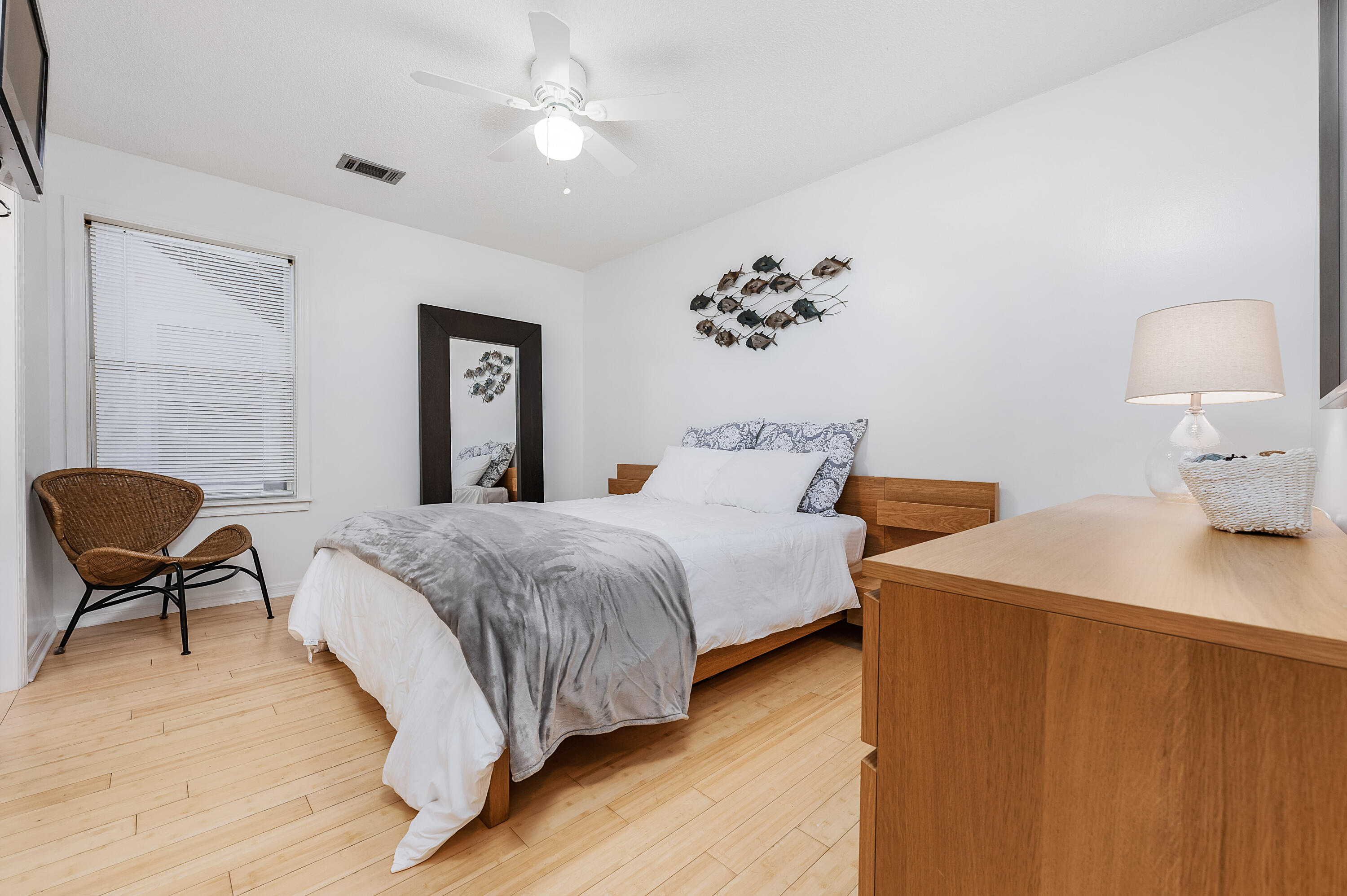 1006 E Highway, Unit 212 Destin, FL 32541 - Photo 12 of 52 a bedroom with a bed and chair