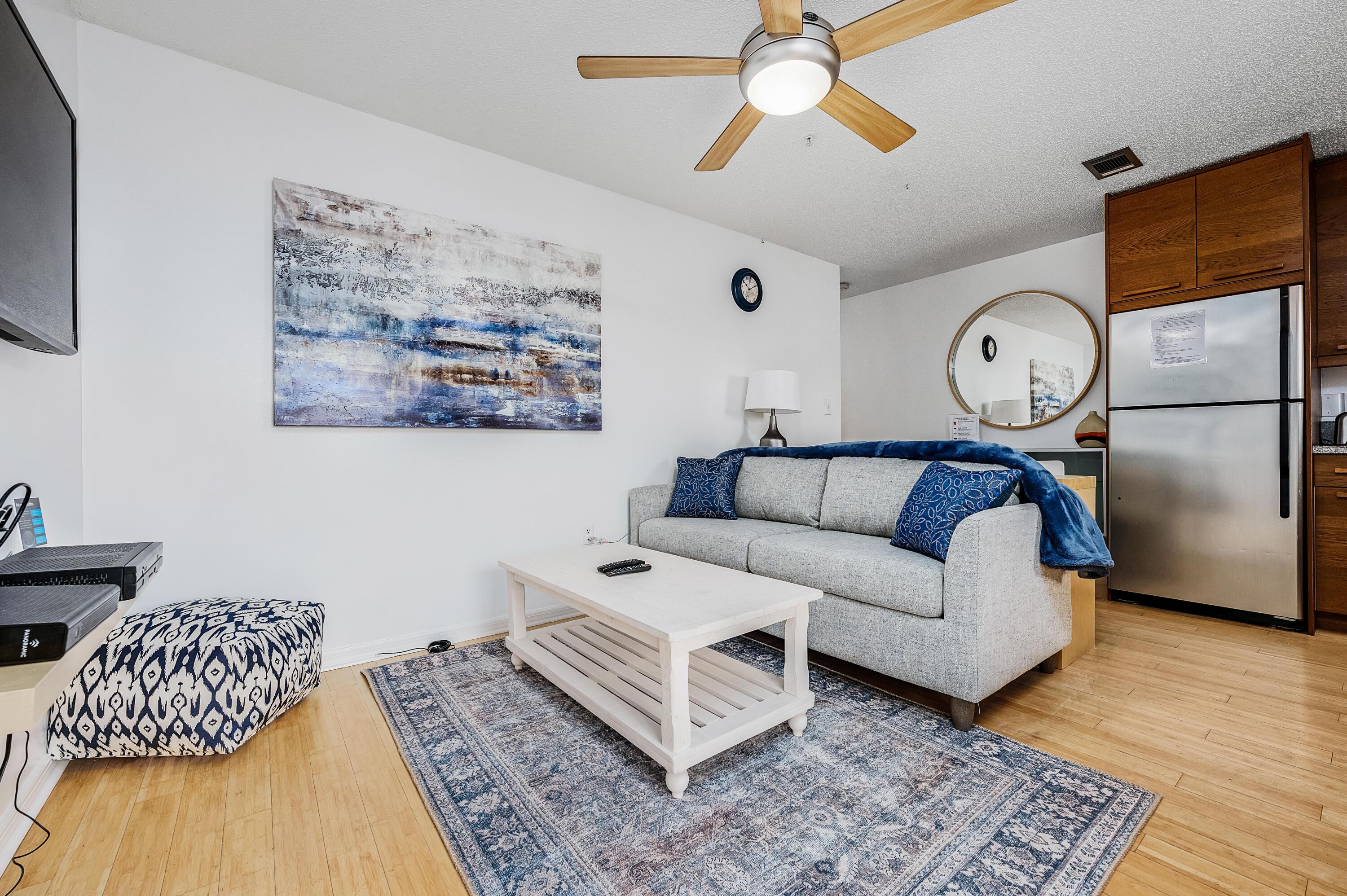 1006 E Highway, Unit 212 Destin, FL 32541 - Photo 3 of 52 a living room with furniture and a rug