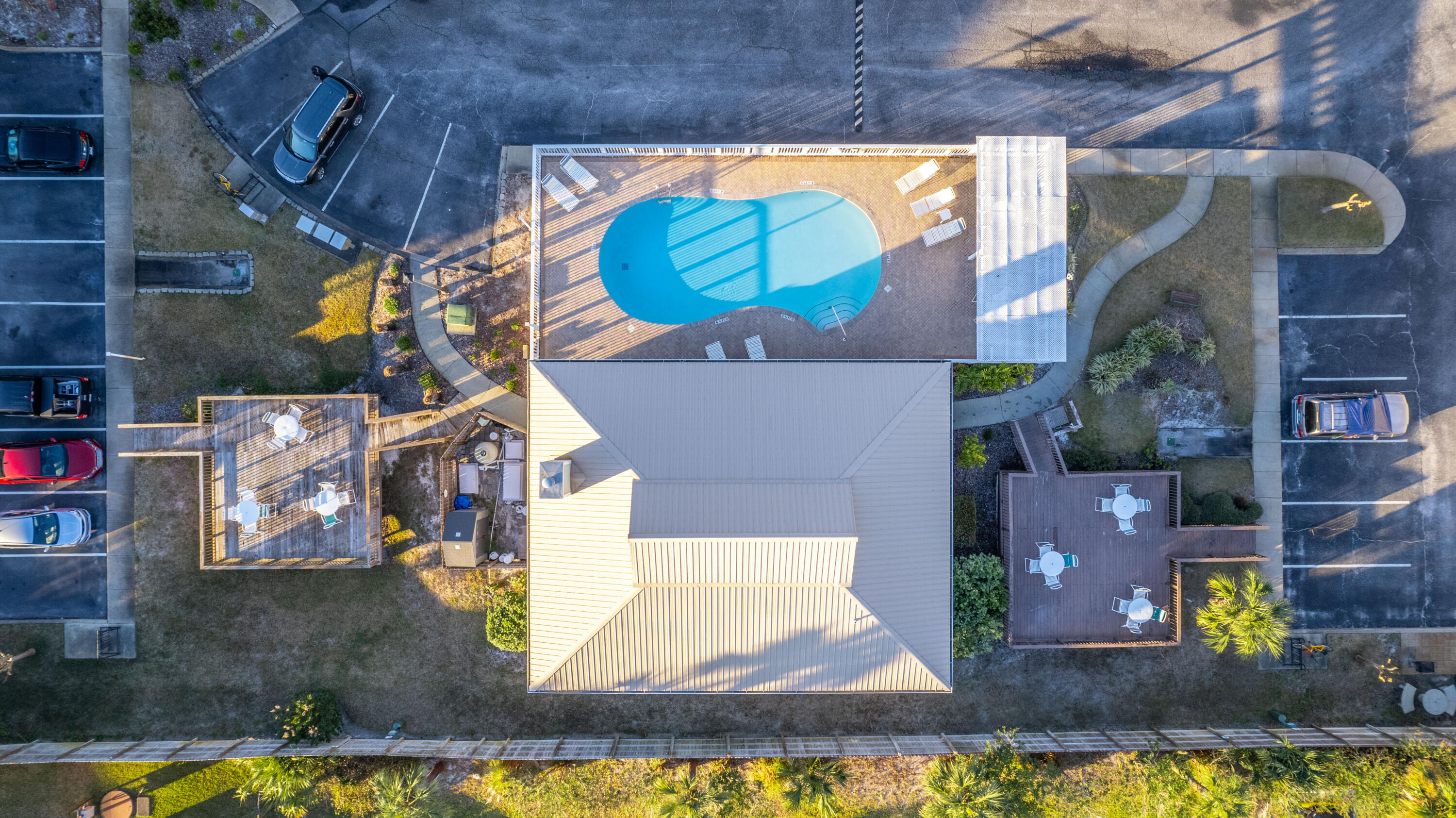 1006 E Highway, Unit 212 Destin, FL 32541 - Photo 39 of 52 a view of houses with an outdoor space and swimming pool