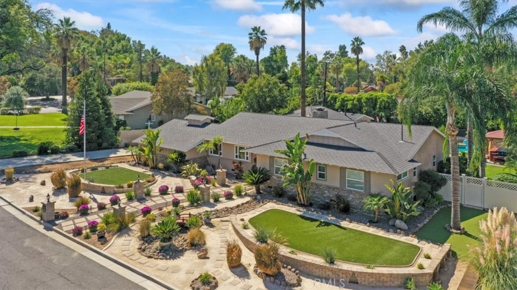 2065 Bronson Way Riverside, CA 92506 - Photo 1 of 75 a view of a swimming pool with a garden
