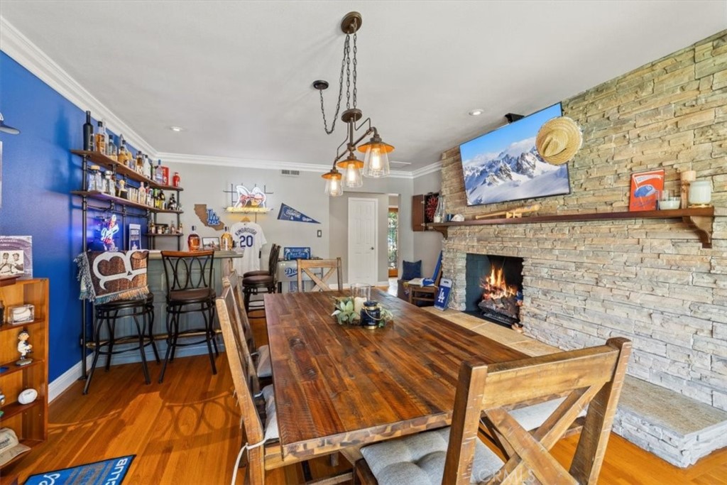 2065 Bronson Way Riverside, CA 92506 - Photo 29 of 75 a living room with furniture a fireplace and a flat screen tv