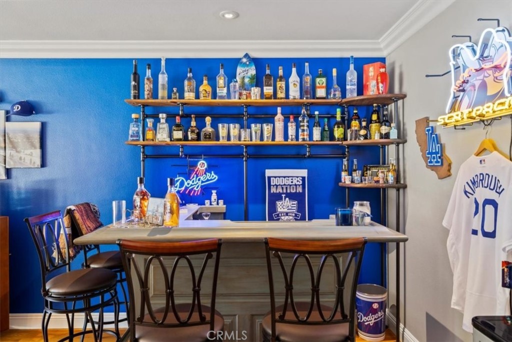 2065 Bronson Way Riverside, CA 92506 - Photo 30 of 75 a outdoor dining room with furniture and a book shelf