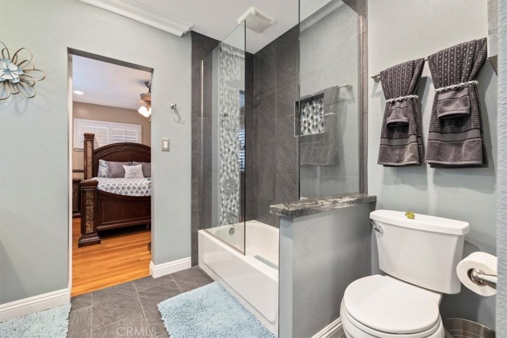 2065 Bronson Way Riverside, CA 92506 - Photo 36 of 75 a bathroom with a toilet a sink and shower